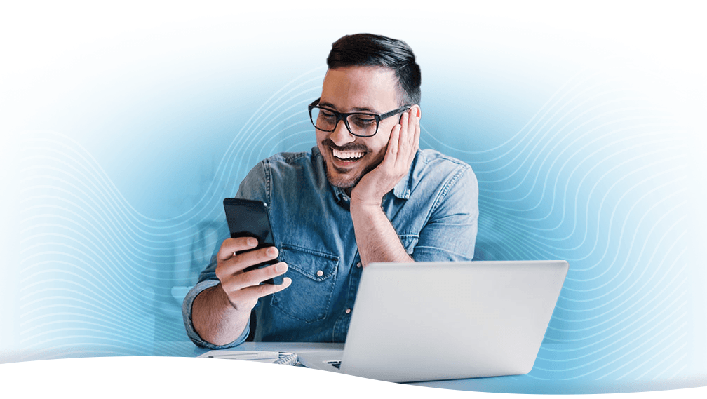 Man joyfully receiving email updates